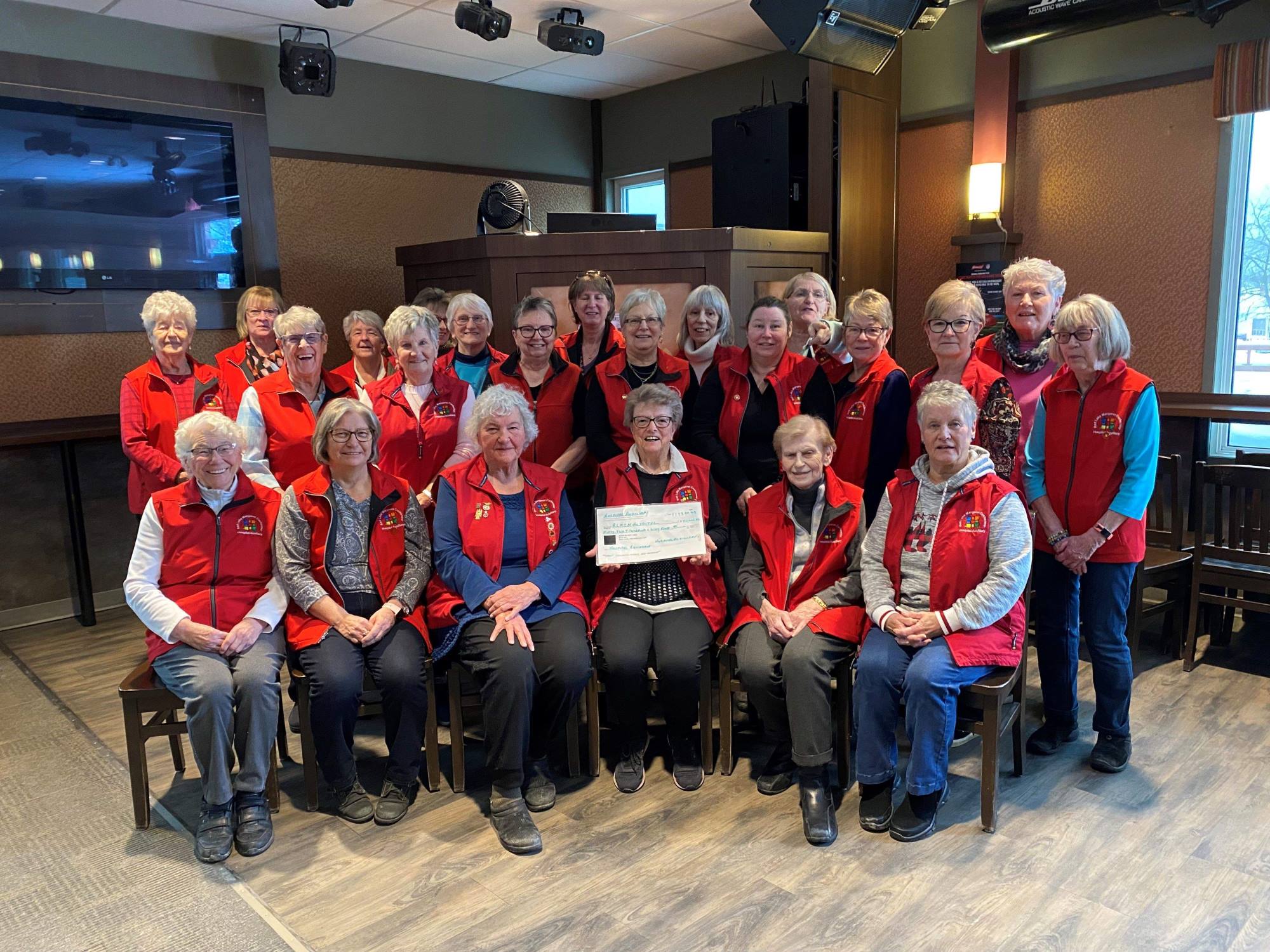 Auxiliary team smiling 